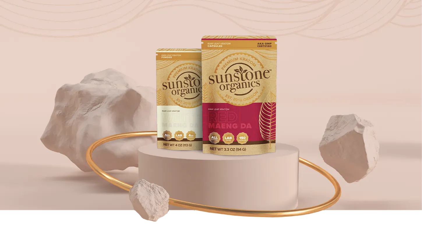 Sunstone Organics products on a decorative stand with a soft pink background