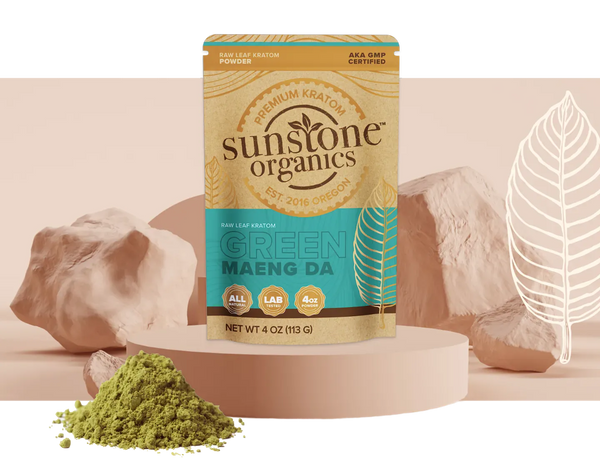 A bag of Sunstone Organics Green Maeng Da kratom beside a pile of the powder
